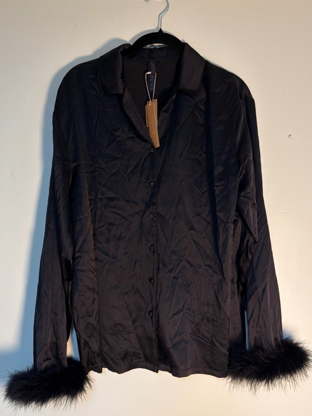 Skims silk feather trim long set color onyx size XS. New with tags.